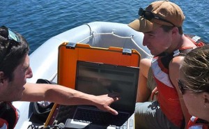 Students use acoustic imaging to select a coring site in southern Alaska lake. Credit/permission D. Kaufman