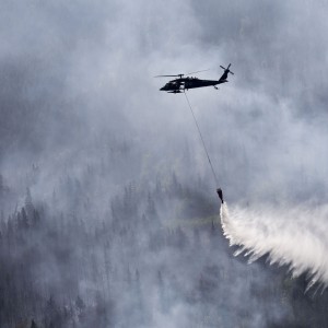 A Black Hawk drops water on the Stetson Creek Fire in Alaska