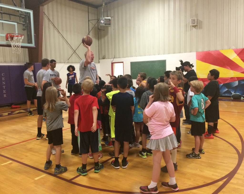 The suns teach basketball to young attendees of the clinic