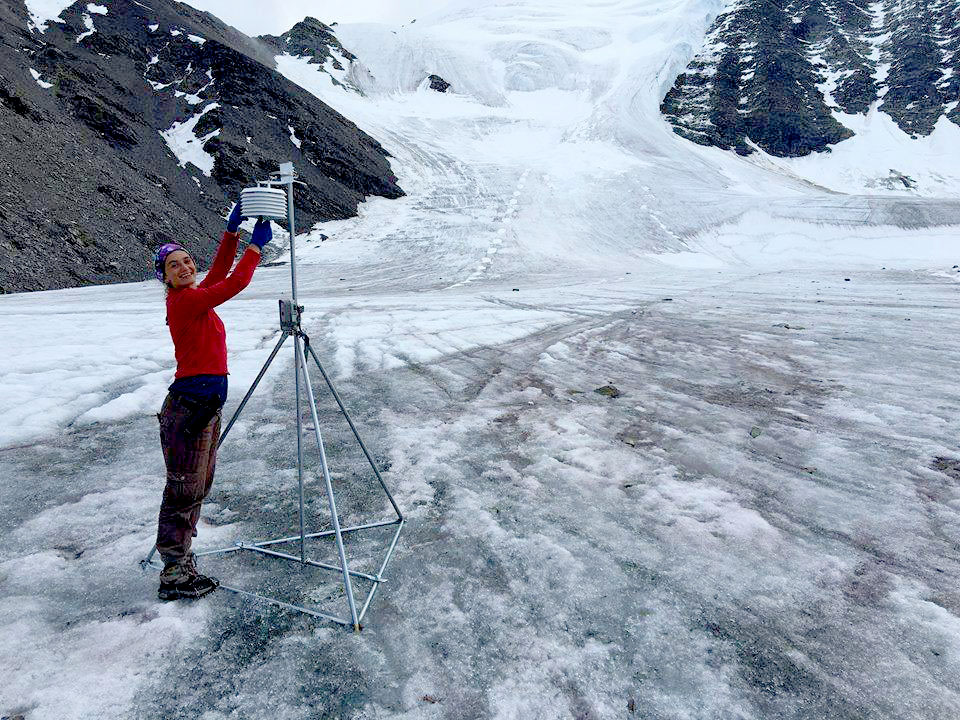 Graduate student Ellie Broadman takes samples on a glacier