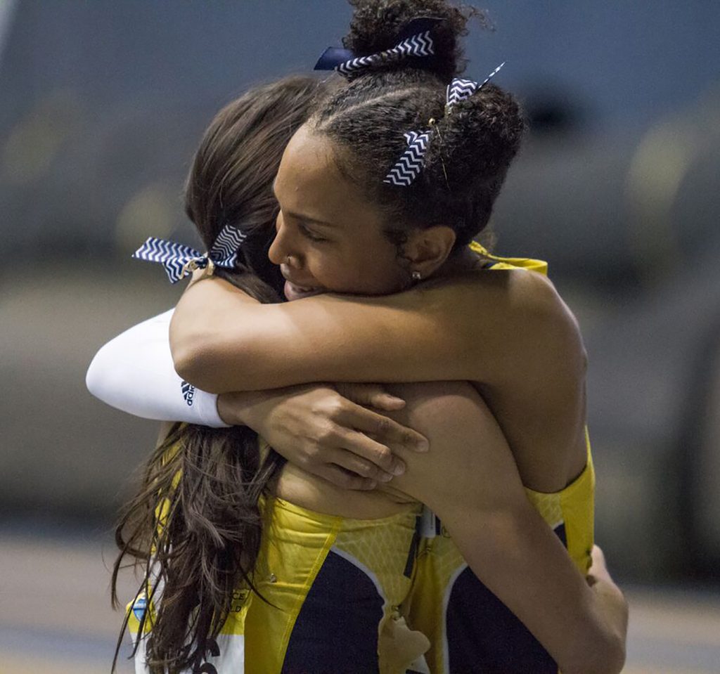 Jasmine Malone hugs teammate