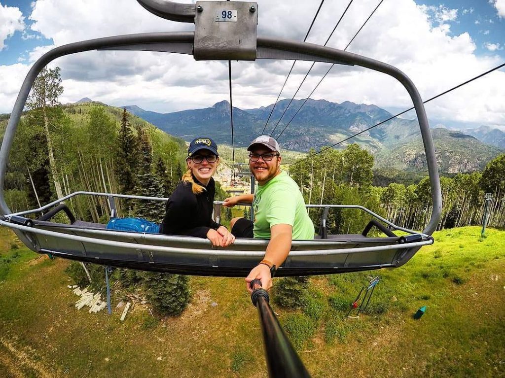 lumberjacks ride a chairlift in Colorado