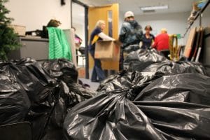 Volunteers sort clothes