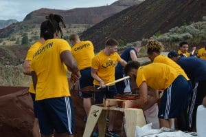 NAU student-athletes fill sandbags