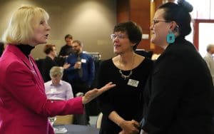 From left, Judge Kathleen Quigley, an NAU alum, talks with Julie Baldwin and Carly Camplain from the Center for Health Equity Research at the juvenile justice workshop on Sept. 26.