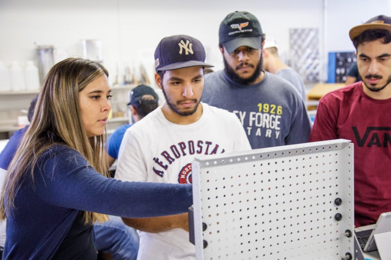 A CEIAS professor teaches engineering principles to students.