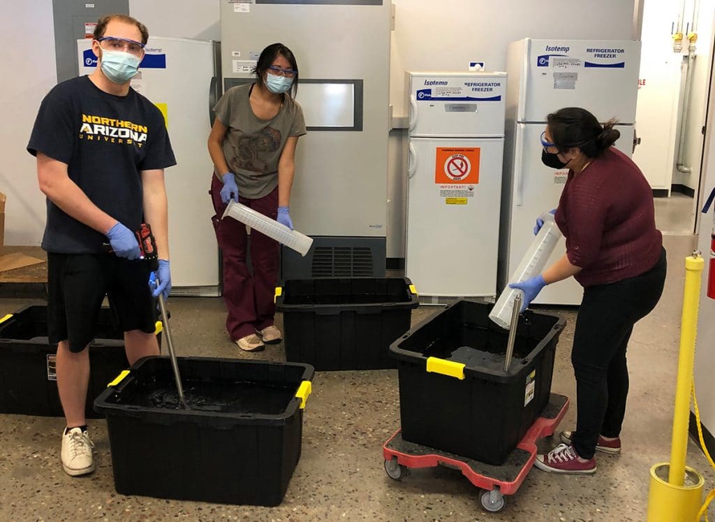 Student researchers prepare hand sanitizer in Jani Ingram's lab.