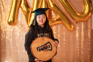 Luyi Liu poses with NAU cookie
