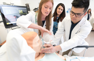 Healthcare students practice on dummy