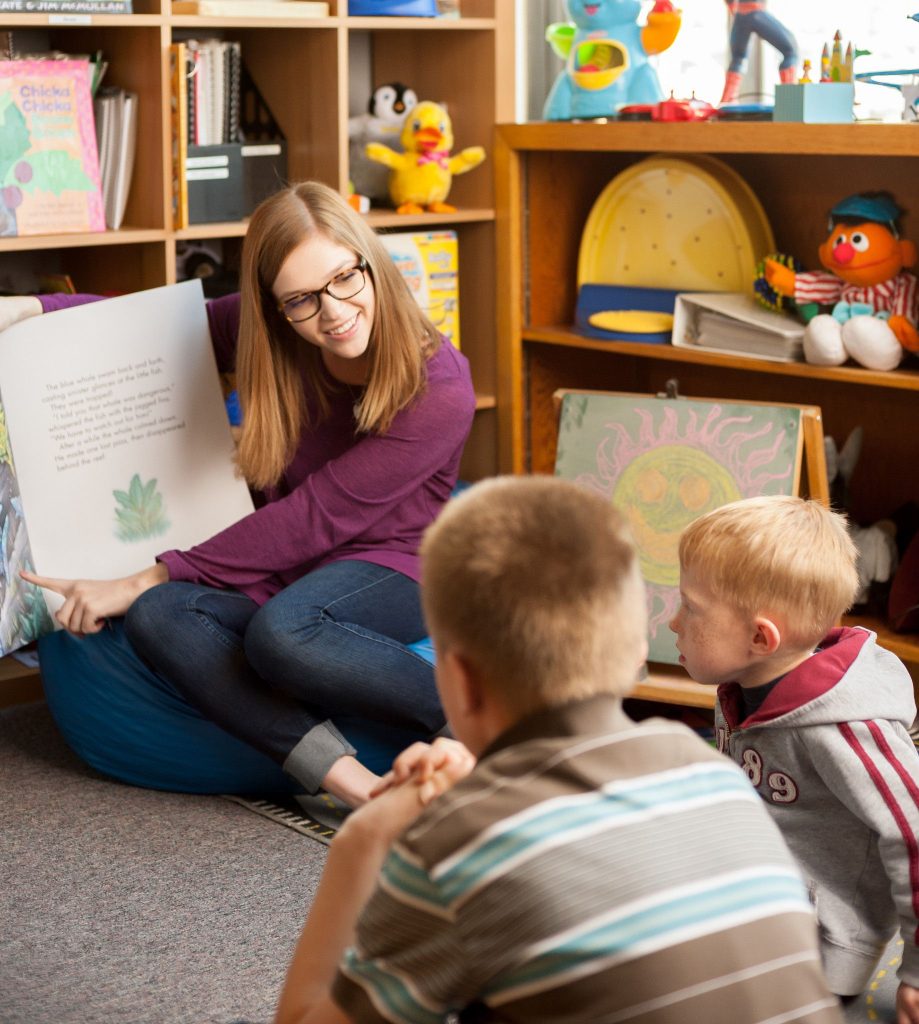 Teacher reads to children
