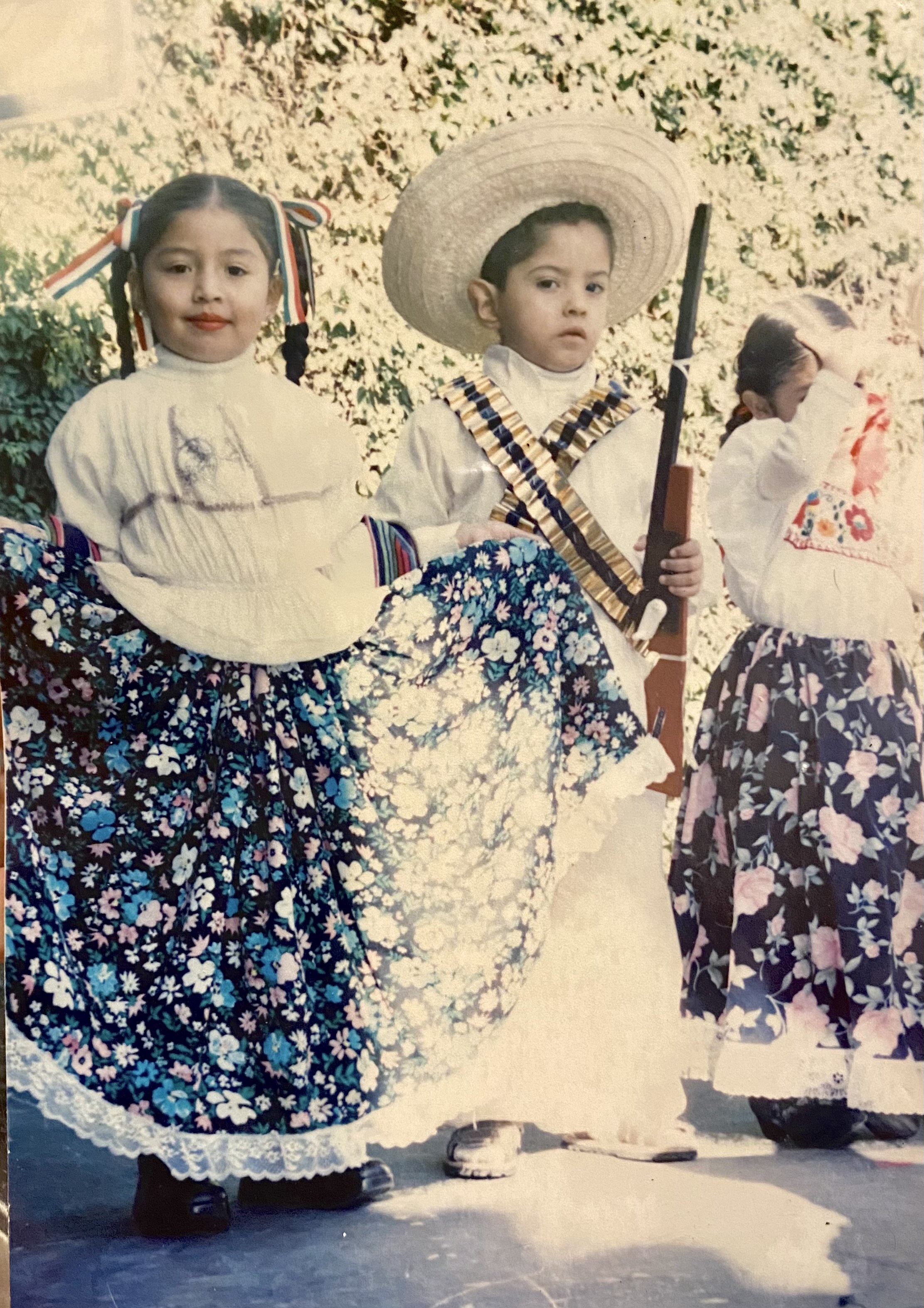 Alvarez at age 5 poses with a boy dressed in costume