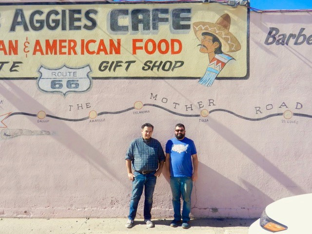 Ivan Pacheco and Lazarus Melan in front of Aggies Cafe