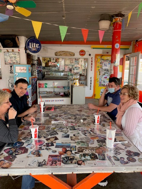 At the world famous Snow Cap restaurant in Seligman, Mirna (far left) and Clarissa (far right) Delgadillo shared with the interns stories and materials from the collection of their father, Angel Delgadillo, who founded the Historic Route 66 Association of Arizona.