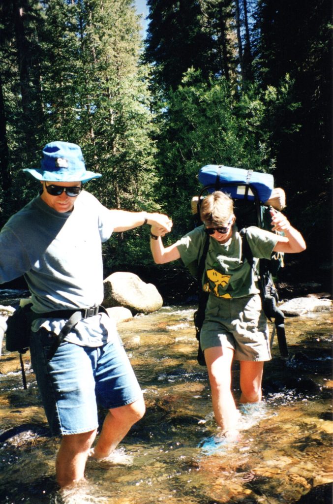 Crossing a river while backpacking