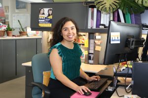 Alexandra Samarron Longorio sitting at her desk