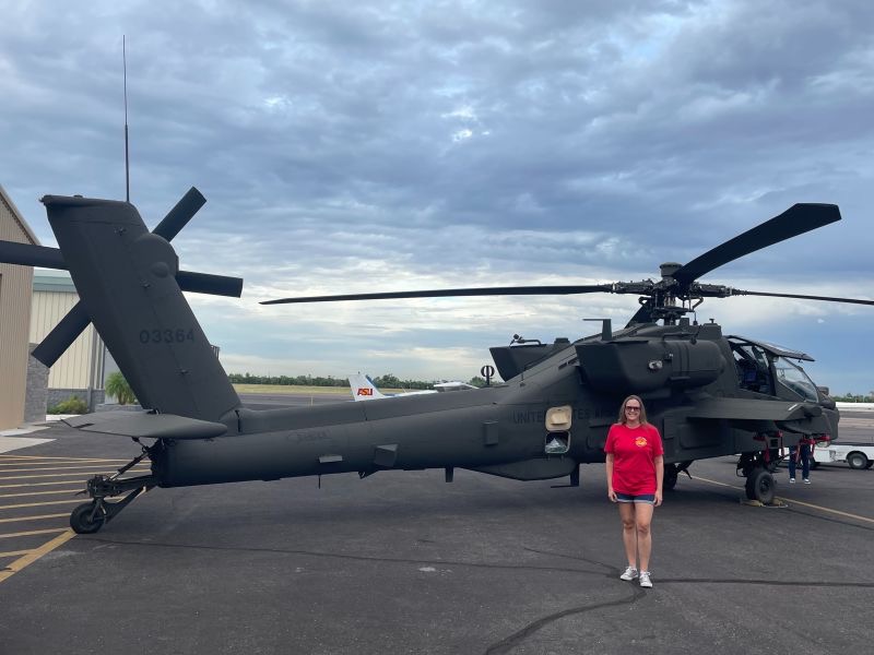 Amanda Nemec in front of a Boeing helicopter
