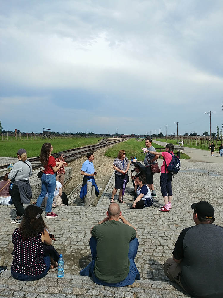 At the ramp of the infamous Auschwitz-Birkenau death camp. Both Doris Martin and Edward Gastfriend, teenagers at the time, were imprisoned here before selected for labor camps.