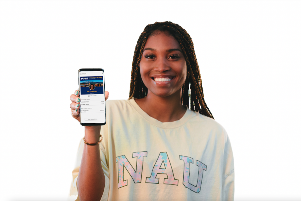 NAU students holds up phone