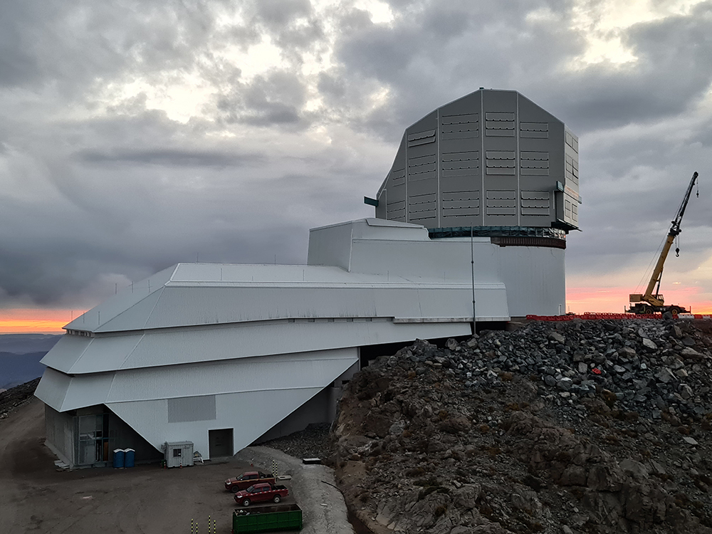 Telescope facility in Chile against cloudy skies