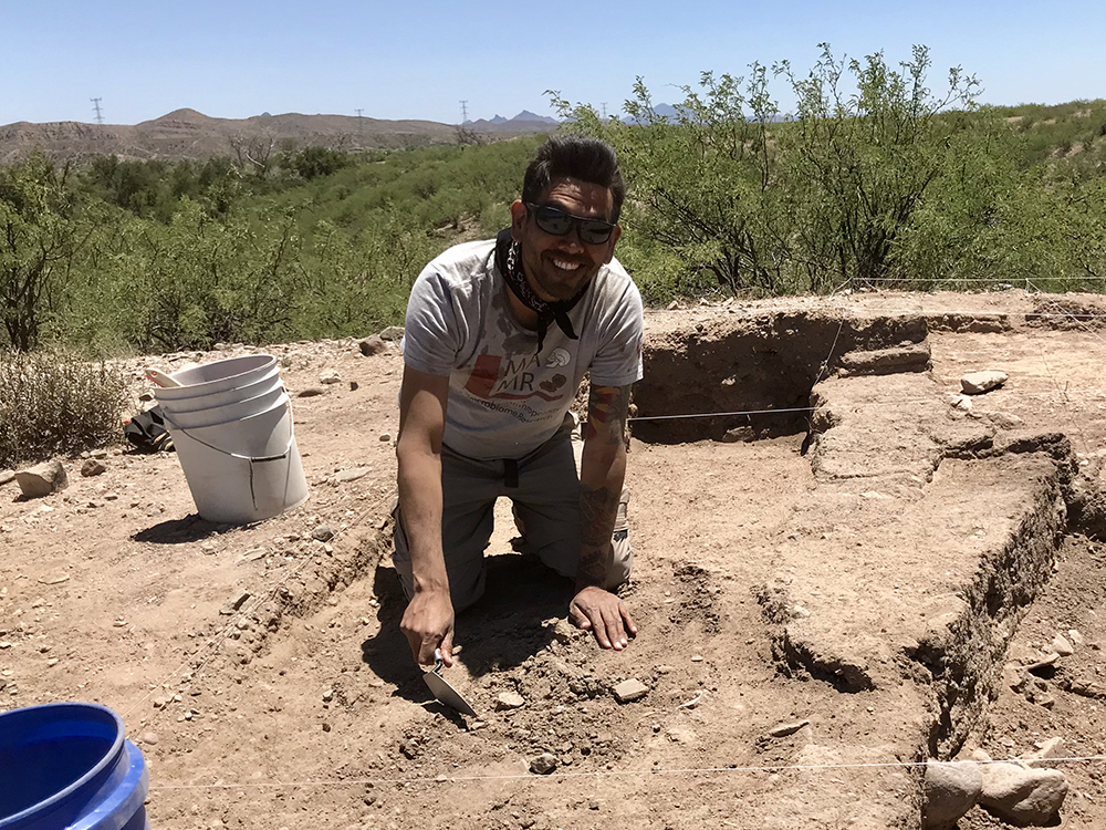 Justin Lund doing archaeological fieldwork