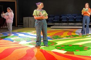 Student actors perform Orlando on a colorful