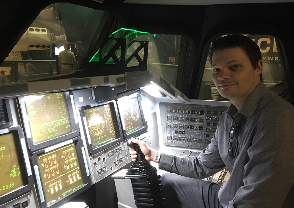 Brian Stone sitting in a flight simulator