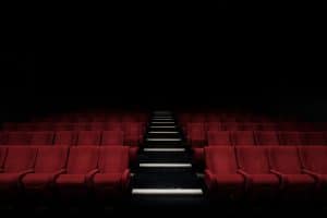 Cinema with red seats in the dark/black background