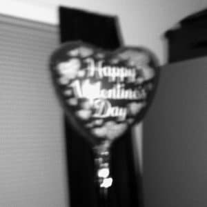 Black and white image of a heart balloon