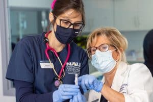 A Yuma nursing student works with a professor