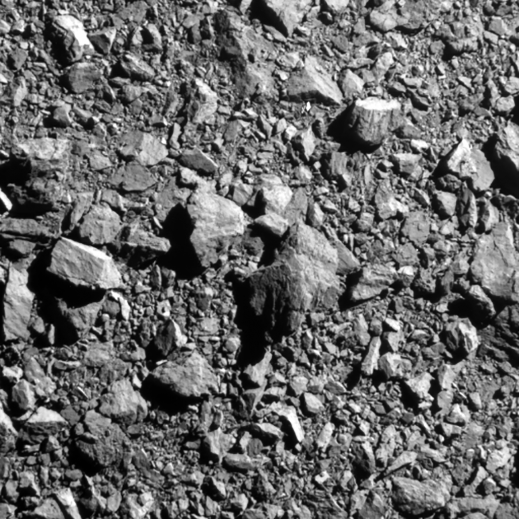 Grayscale image of rocky asteroid surface