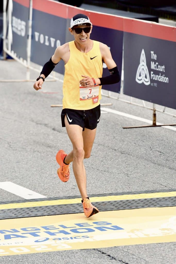Hosava Kretzmann crossing the finish line at the LA Marathon