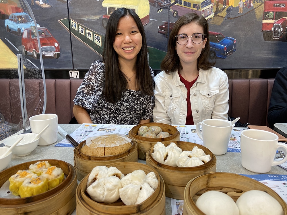 Cate Cameron with a friend eating dim sum in Hong Kong