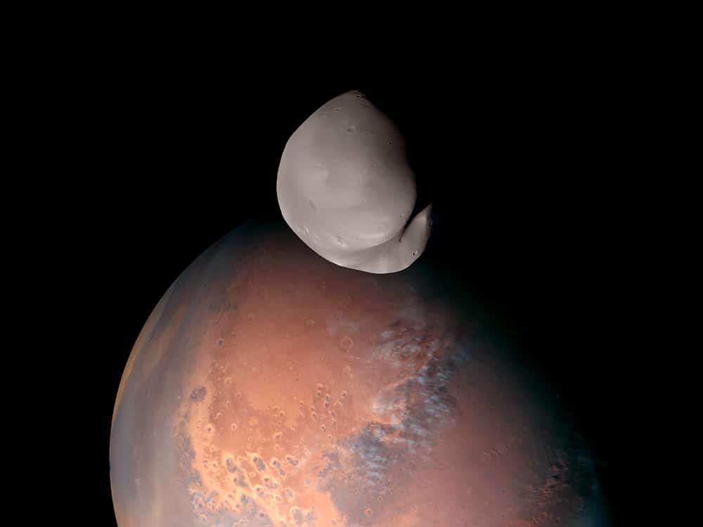 A striking view of Mars and its smallest moon, Deimos. This composite was created from several images taken by the EXI instrument aboard the Emirates Mars Mission when it traveled within about 100 km of Deimos. Credit: Emirates Mars Mission