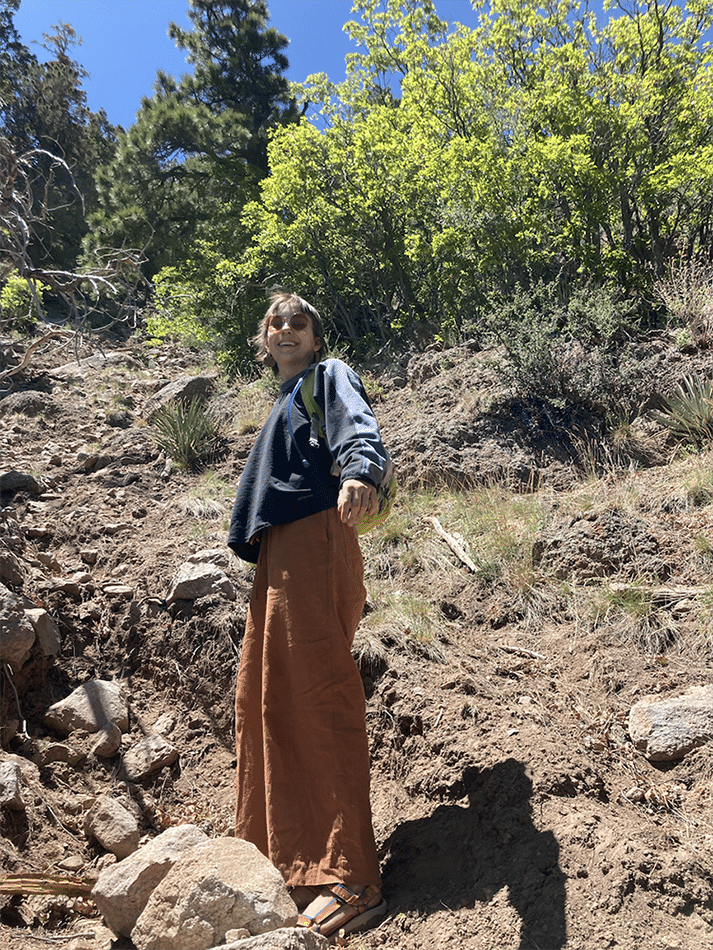 Sophia Swainson wearing sunglasses and hiking