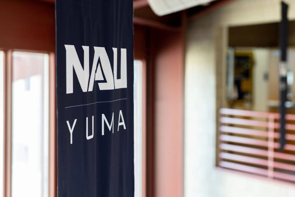 NAU Yuma banner hanging from building ceiling