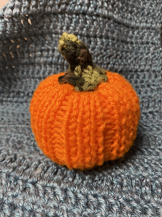 An orange crocheted pumpkin