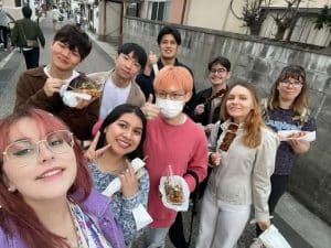 Fatima Luna poses with friends in Japan.