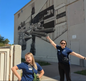 Kristin Iott & Samantha Milewski – in front of the mural