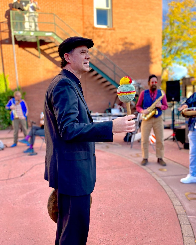 Wallace with a gong mallet at 2022 Heritage Square Interference Series performance—photo credit Owen Davis