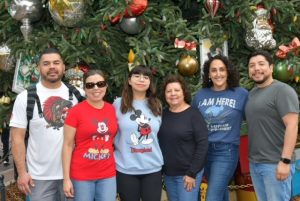 The Robles family posing at DisneyLand