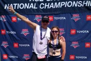 Scot and Jillian Raab with medals around their necks after a triathlon competition
