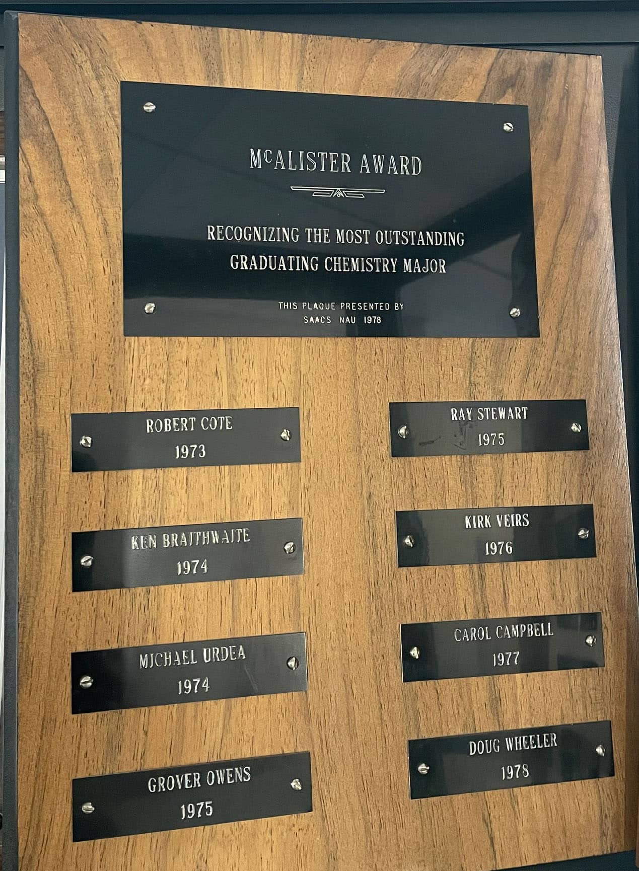 McAlister Award plaque with a list of several students' names.