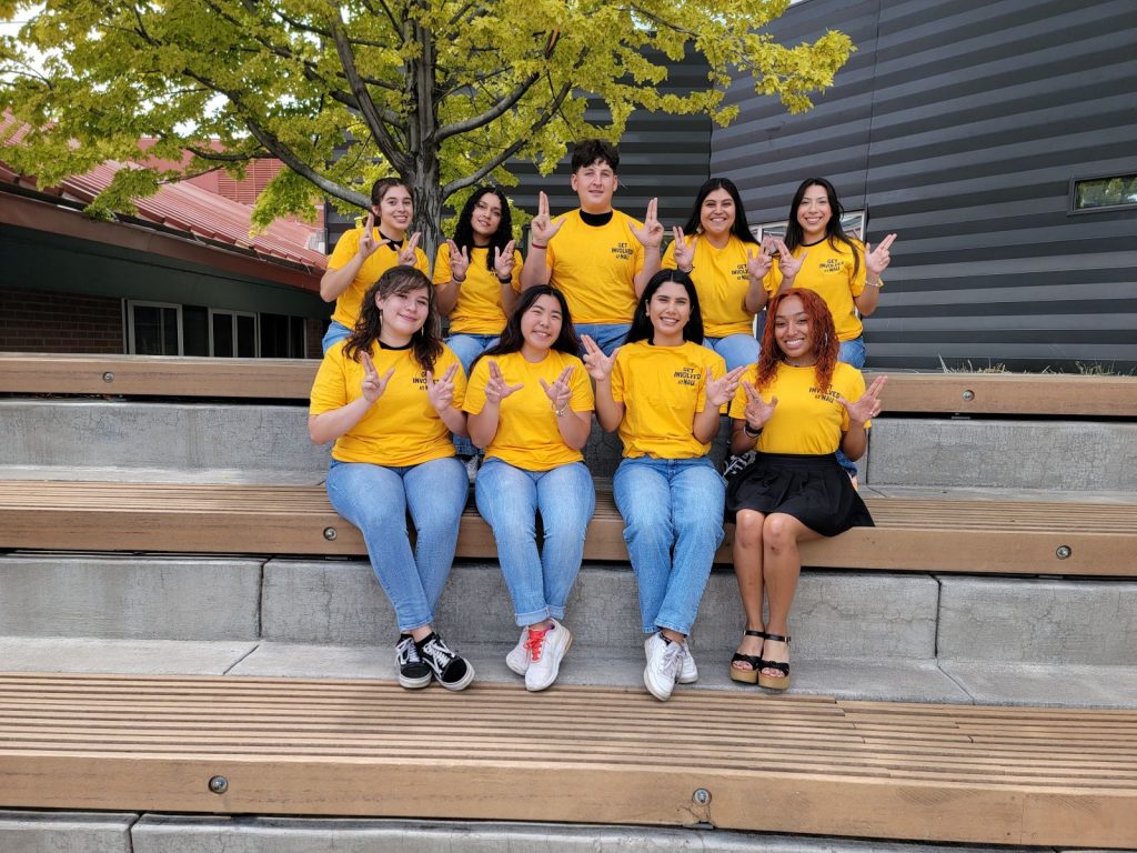 Group of Get Involved Program participants wearing matching yellow shirts.
