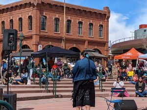 A book festival reading taking place at Heritage Square in downtown Flagstaff.