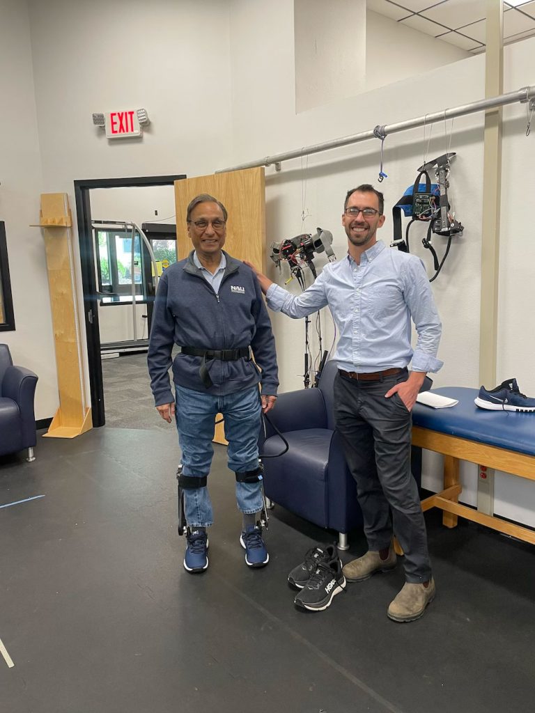 Steve Sanghi with Zach Lerner in a robotics lab