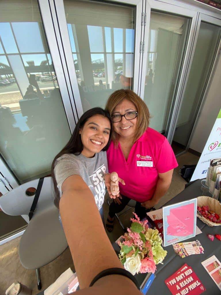 Jocelyn Andrade taking a selfie with an employee of New Life Pregnancy Center