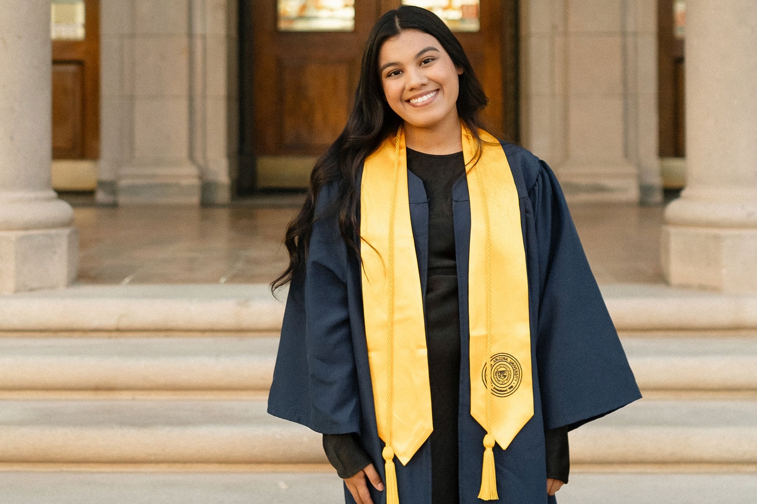 Headshot of Jocelyn Andrade in graduation regalia