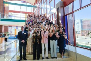 Distinguished Seniors and Gold Axe winners do LJs on steps at High Country Conference Center