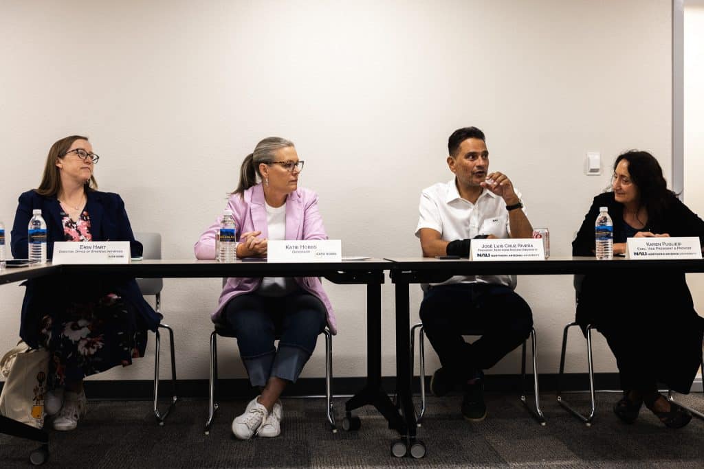 Katie Hobbs, President Cruz Rivera, Provost Pugliesi and a governor staff member sitting at a table together