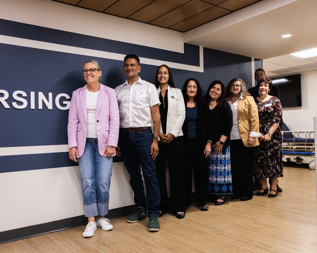 Arizona Governor Katie Hobbs posing at the NAU College of Nursing with NAU leaders